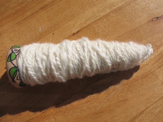 drop spindle with yarn